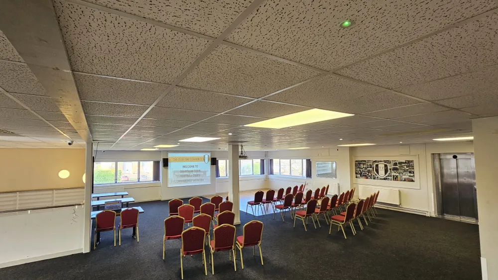 Event space in lecture theatre layout with seating and presentation area